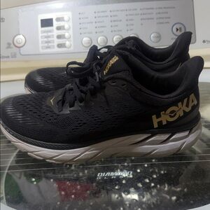 Hoka Black and Gold Athletic Sneakers